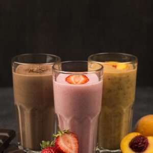 front-view-assortment-milkshakes-with-chocolate-fruits Chocolate,Strawberry and Peach